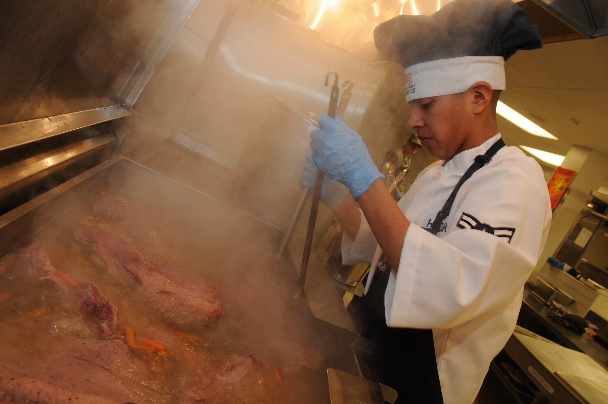 Airman 1st Class Damian Huizar with the 185th services fight prepares corned beef brisket for the afternoon meal at the 185th Air Refueling Wing (ARW) kitchen on March 01, 2014. The 185th ARW services flight is one of three units in the nation competing for the best kitchen Disney Award.
U.S. Air National Guard Photo by: Tech Sgt. Oscar Sanchez/Released
