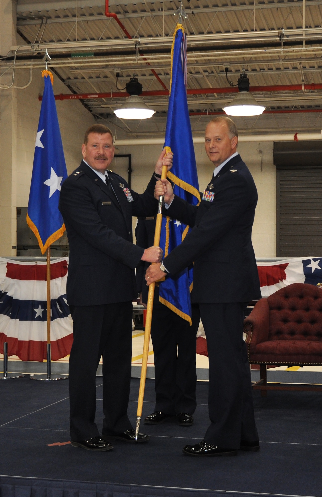 Major General Mark Kyle, 22nd Air Force Commander, passes the flag to Colonel Steven B. Parker during the Change of Command, symbolizing Col. Parker’s assumption of command of the 914th Airlift Wing, March 1, 2014. (U.S. Air Force photo by Staff Sgt. Stephanie Clark) 