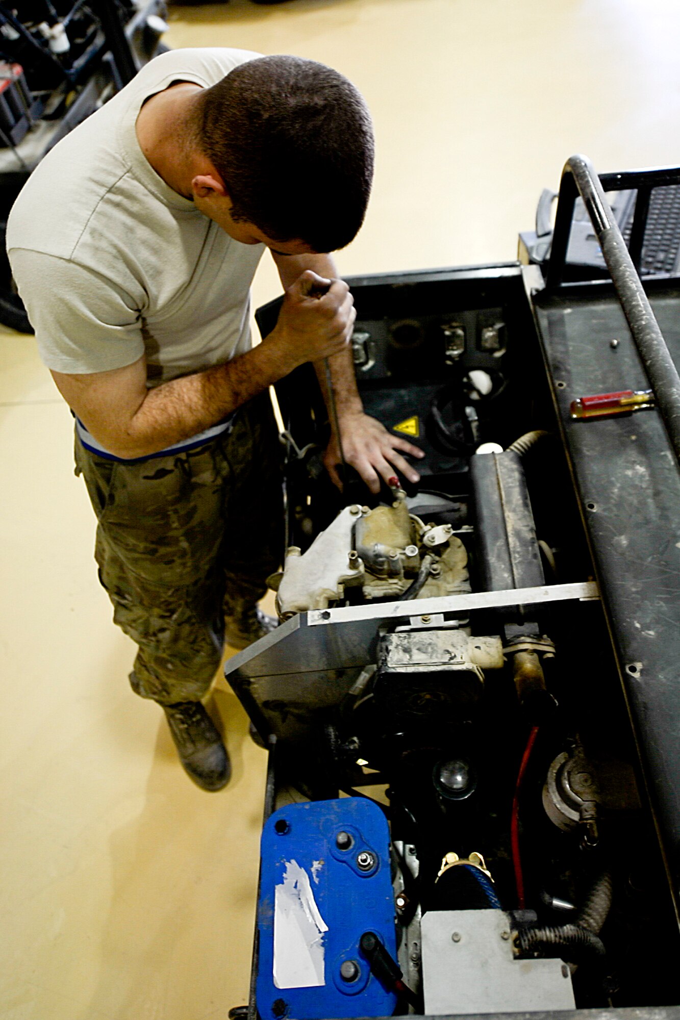 U.S. Air Force Senior Airman Franky Frias, 455th Expeditionary Maintenance Squadron AGE technician, troubleshoots a heater at Bagram Airfield, Afghanistan, Feb. 28, 2014. The heater received maintenance due to not having a generator output. (U.S. Air Force photo by Senior Airman Kayla Newman/Released)

