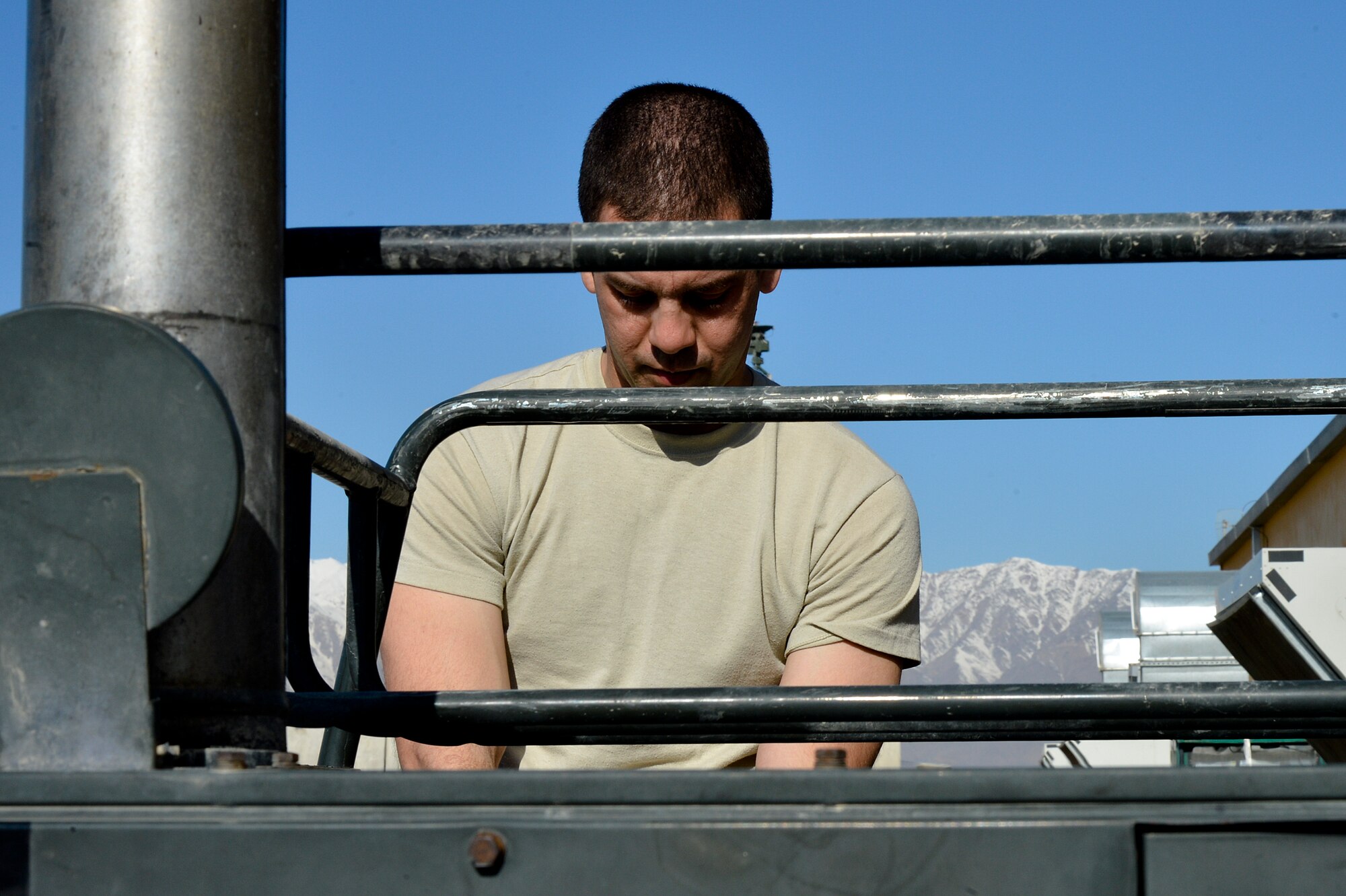 U.S. Air Force Senior Airman Franky Frias, 455th Expeditionary Maintenance Squadron AGE technician, troubleshoots a heater at Bagram Airfield, Afghanistan, Feb. 28, 2014. The heater received maintenance due to not having a generator output. (U.S. Air Force photo by Senior Airman Kayla Newman/Released)