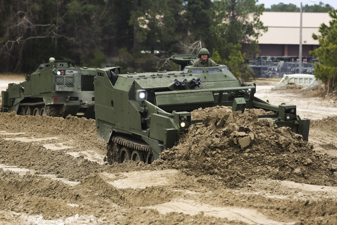 MARINE CORPS BASE CAMP LEJEUNE--Sgt. Robert Kubach, the operations chief for 2nd Combat Engineering Battalion and Cleveland native, operates the improved M9 Armored Combat Earth-mover during a familiarization exercise Feb. 26, 2014.  The M9 ACE is the improved version of the Legacy ACE; it has an upgraded and reinforced hull, more powerful engine and improved hydraulic system.  