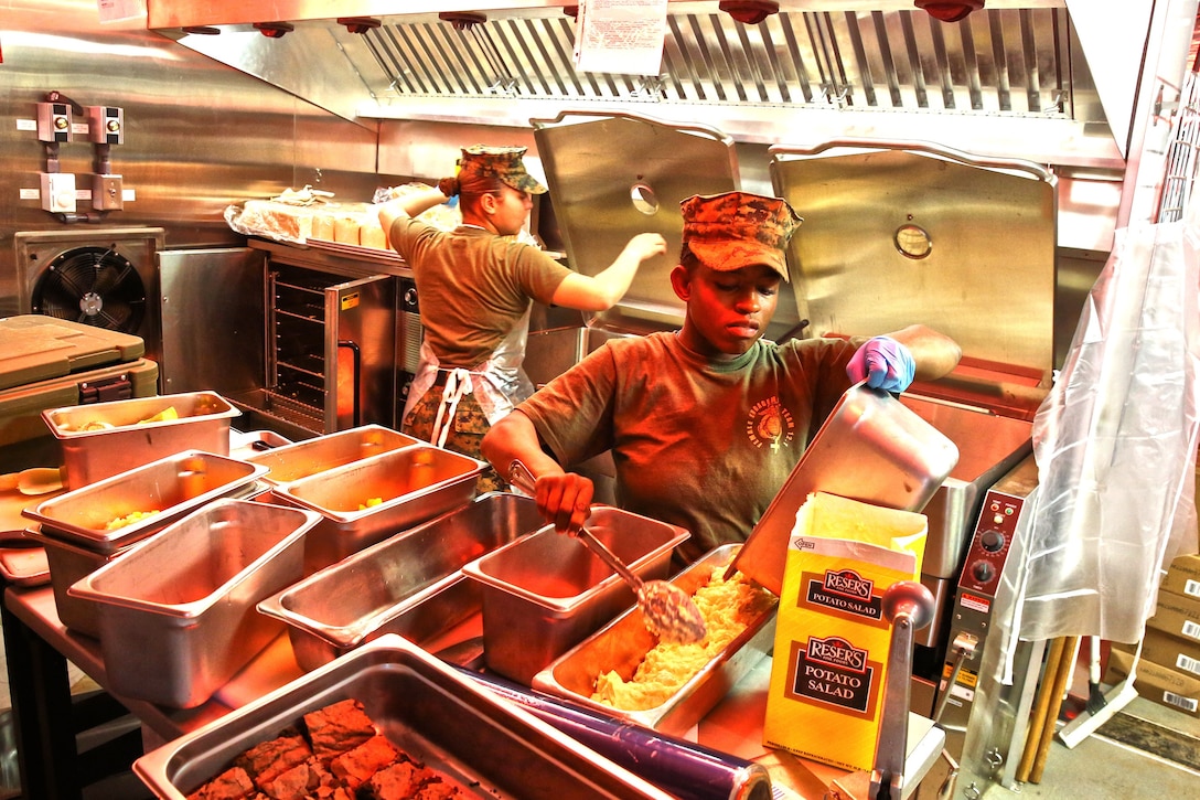 Marines with Food Service Company, Combat Logistics Regiment 17, 1st Marine Logistics Group, prepare lunch during a Major General W.P.T. Hill Memorial Award competition aboard Camp Pendleton, Calif., Feb. 26, 2014. The Marines defended their title as the best field mess in the Marine Corps, which they earned during last year’s awards, competing against the best selected food service units the Marine Corps has to offer. 