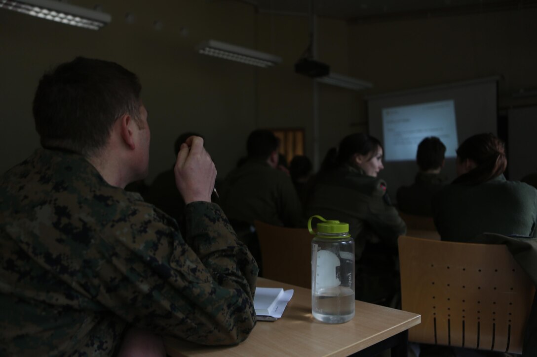 Petty Officer 2nd Class Adam J. Voegtle, a Belleville, Ill., native and hospital corpsman with 2nd Supply Battalion, Combat Logistics Regiment 25, 2nd Marine Logistics Group, and medical officers with Joint Medical Task Force, Host Nation Support Battalion attend classes about airway, breathing and circulation injuries at Vaernes Garrison, Norway, Feb. 26, 2014. The joint training gave service members an opportunity to improve international relations and interoperability between United States and Norwegian medical personnel.