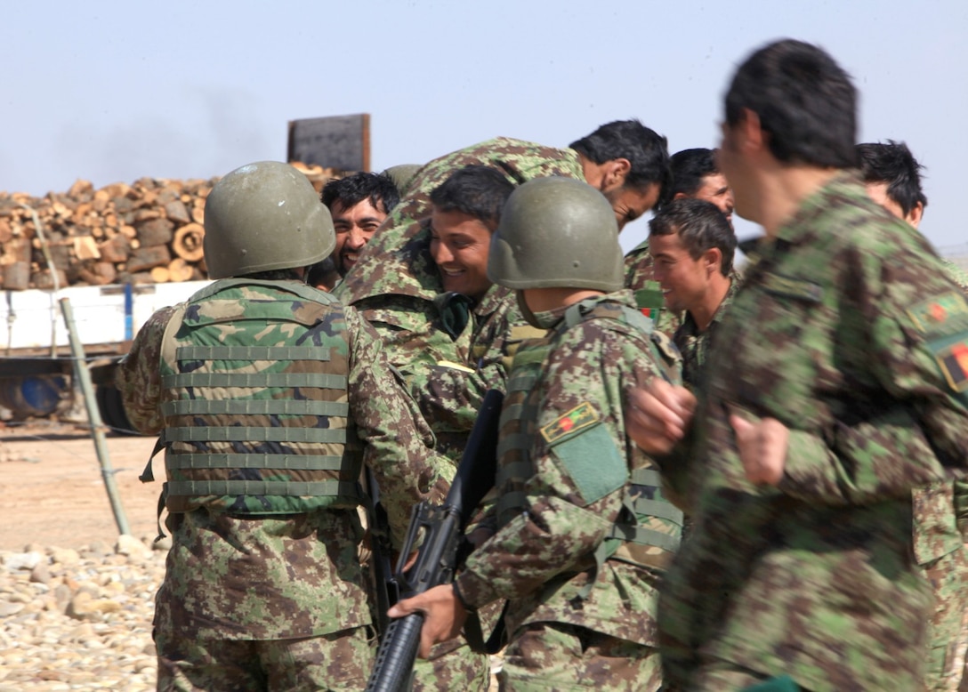 Afghan National Army soldiers with the 215th Corps  perform a simulated casualty evacuation during a helicopter training exercise as part of the Noncommissioned Officer Battle Course aboard Camp Shorabak, Helmand province, Afghanistan, Feb. 19, 2014. The 10-week course provides the ANA soldiers with map-reading skills, small-arms weapons handling, and mounted and dismounted patrolling training. (U.S. Marine Corps photo by Cpl. Joshua Young)