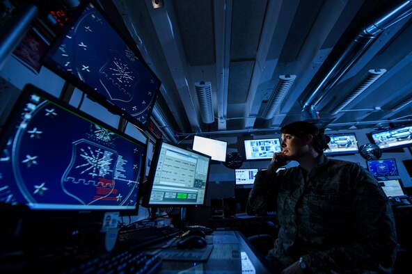 Tech. Sgt. Amber Perry monitors base activities to help facilitate the wing's mission Feb. 24, 2014, at Barksdale Air Force Base, La. Perry is a 2nd Bomb Wing command post controller. (U.S. Air Force photo/Staff Sgt. Jonathan Snyder) 