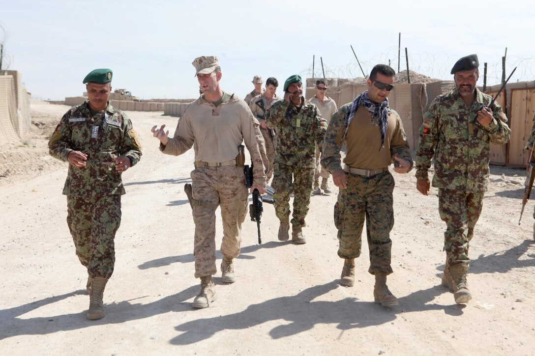 Afghan National Army Soldiers with 2nd Brigade, 215th Corps, and Marines with Security Force Assistance Advisor Team 2-215 conducted a site survey of the landing zone, Feb. 24, aboard Forward Operating Base Robinson, Helmand province. In order to bring Afghan helicopters in to FOB Robinson, the area must be safe, secure and large enough for aircraft to land in order to provide logistical and medical support. (U.S. Marine Corps photo by Cpl. Joshua Young)