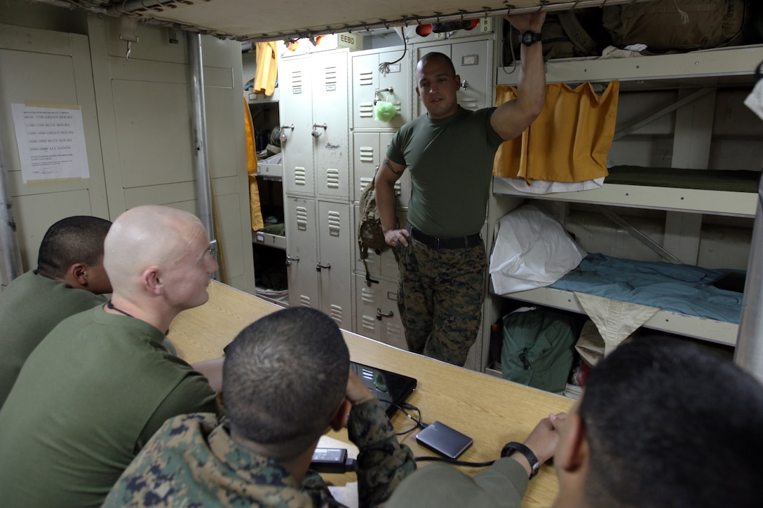 USS DENVER, At Sea – Sergeant Walter J. Krueger (top), a squad leader for Company F., Battalion Landing Team 2nd Battalion, 5th Marine Regiment, 31st Marine Expeditionary Unit and a native of Memphis, Tenn., passes instructions to his squad inside the berthing area here, March 2. He is recognized as one of the best leaders in his unit, highlighted by his ability to mentor and develop young Marines. Krueger and the Marines of BLT 2/5 are currently deployed with the 31st MEU aboard the ships of the Bonhomme Richard Amphibious Ready Group as part of a regularly scheduled Spring Patrol of the Asia-Pacific region. (Marine Corps photo by Sgt. Paul Robbins Jr.)