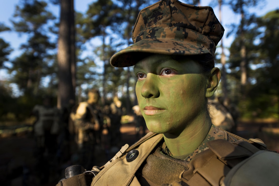 Pfc. Christina Fuentes Montenegro prepares to hike to her platoon's defensive position during patrol week of Infantry Training Battalion near Camp Geiger, N.C. on Oct. 31, 2013. Fuentes Montenegro is one of the first three females to ever graduate from Infantry Training Battalion. Department of Defense recognizes March as Women’s History Month.