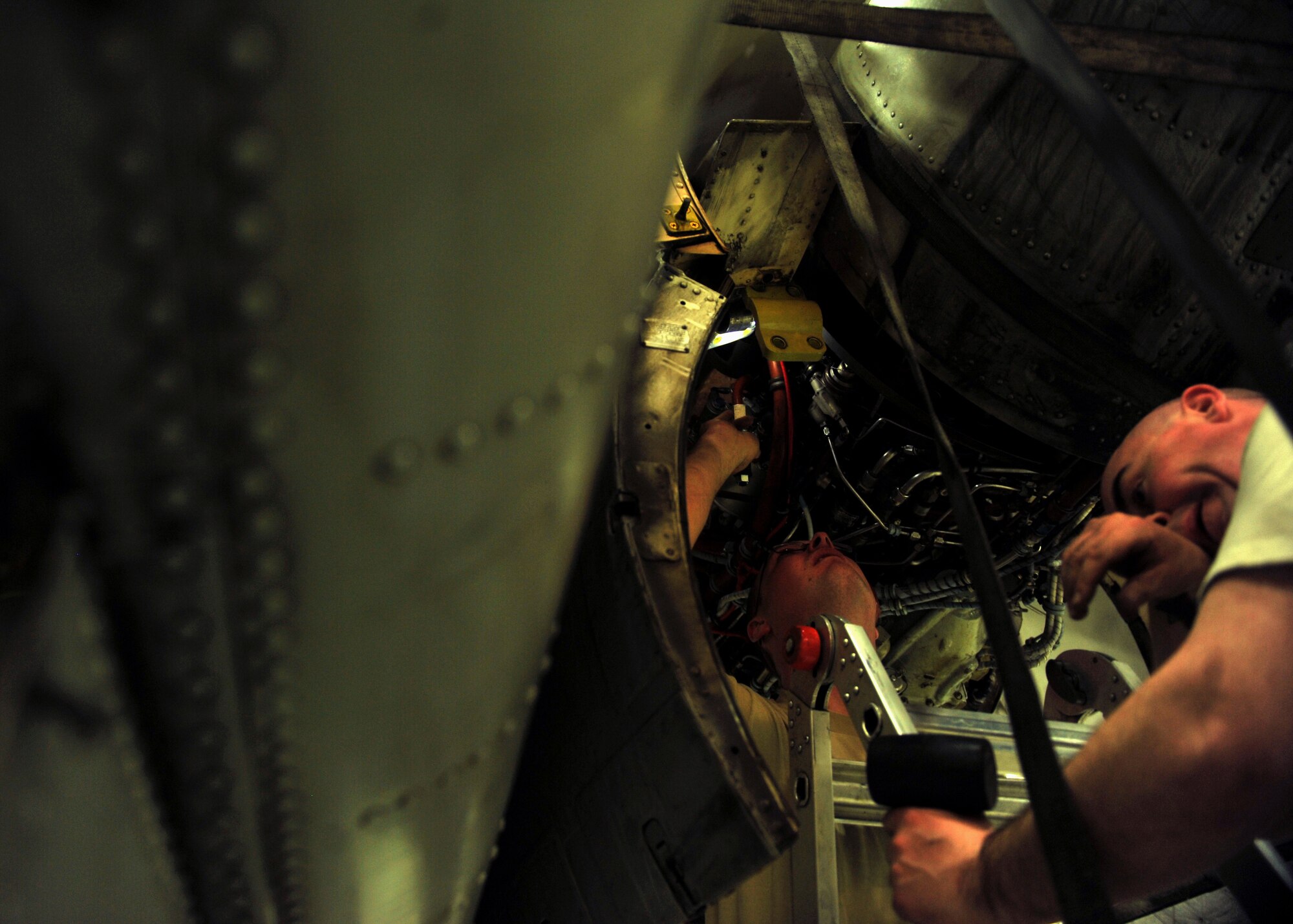 Staff Sgt. Tristan Davis, left, and Tech. Sgt. Clinton Kersey, 51st Aircraft Maintenance Squadron aerospace propulsion craftsmen, prepare to tighten an A-10 Thunderbolt II engine onto the aircraft’s engine mount at Osan Air Base, Republic of Korea, Feb. 28, 2014. The Airmen who work on Osan’s A-10 engines are fully trained and qualified to handle a multitude of procedures. (U.S. Air Force photo/Senior Airman Siuta B. Ika)