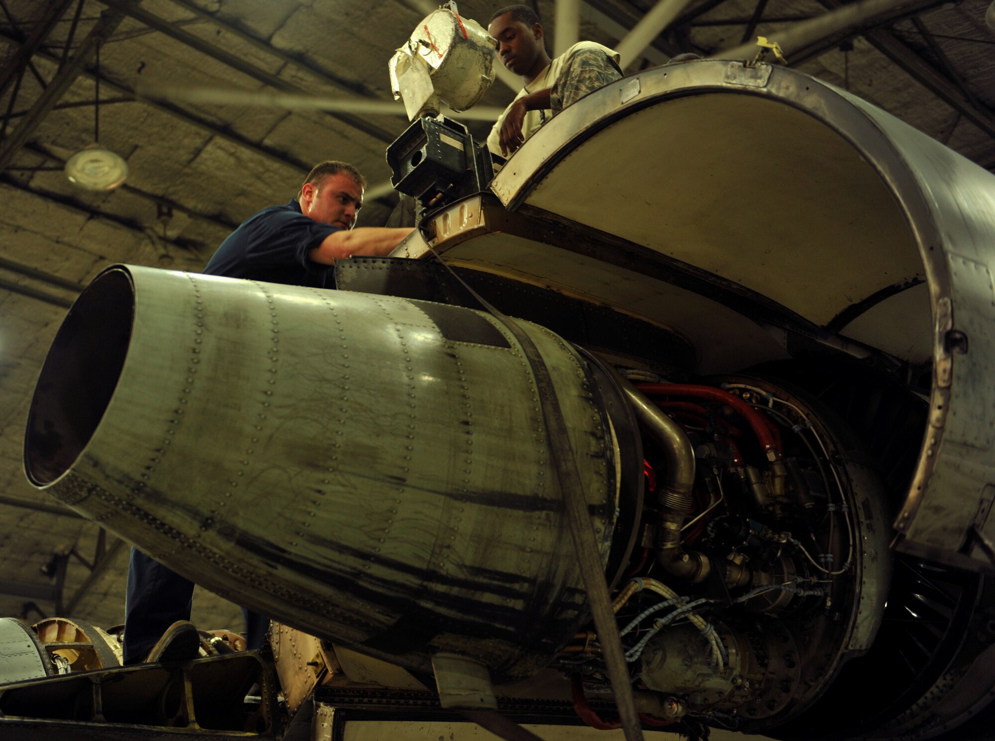 Tech. Sgt. John Perez, 51st Maintenance Squadron propulsion section lead technician, guides an A-10 Thunderbolt II engine into place at Osan Air Base, Republic of Korea, Feb. 28, 2014. Aerospace propulsion specialists from the 51st MXS ensure A-10 engines are in first-rate operational condition. (U.S. Air Force photo/Senior Airman Siuta B. Ika)