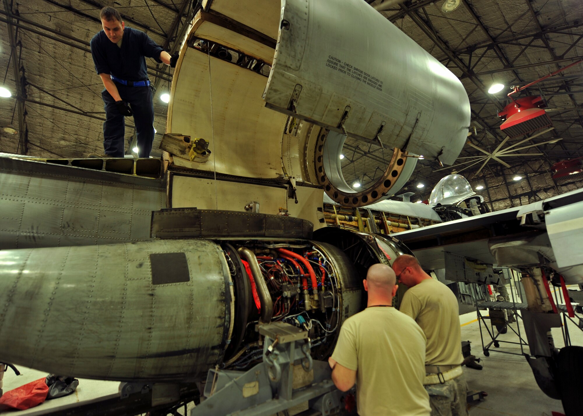 Propulsion technicians from the 51st Maintenance Squadron and 51st Aircraft Maintenance Squadron prepare an A-10 Thunderbolt II engine to be mounted on the aircraft’s frame at Osan Air Base, Republic of Korea, Feb. 28, 2014. The Airmen who work on Osan’s A-10 engines are fully trained and qualified to handle a multitude of procedures. (U.S. Air Force photo/Senior Airman Siuta B. Ika)