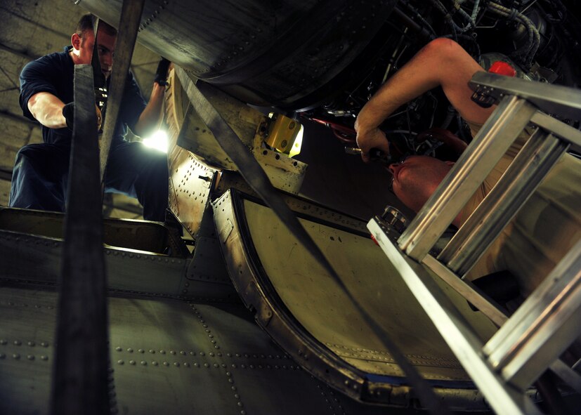 Tech. Sgt. John Perez, left, 51st Maintenance Squadron propulsion section lead technician, provides oversight to Staff Sgt. Tristan Davis, 51st Aircraft Maintenance Squadron aerospace propulsion craftsman, as he prepares to tighten an A-10 Thunderbolt II engine onto the aircraft’s engine mount at Osan Air Base, Republic of Korea, Feb. 28, 2014. Aerospace propulsion specialists from the 51st MXS ensure A-10 engines are in first-rate operational condition. (U.S. Air Force photo/Senior Airman Siuta B. Ika)
