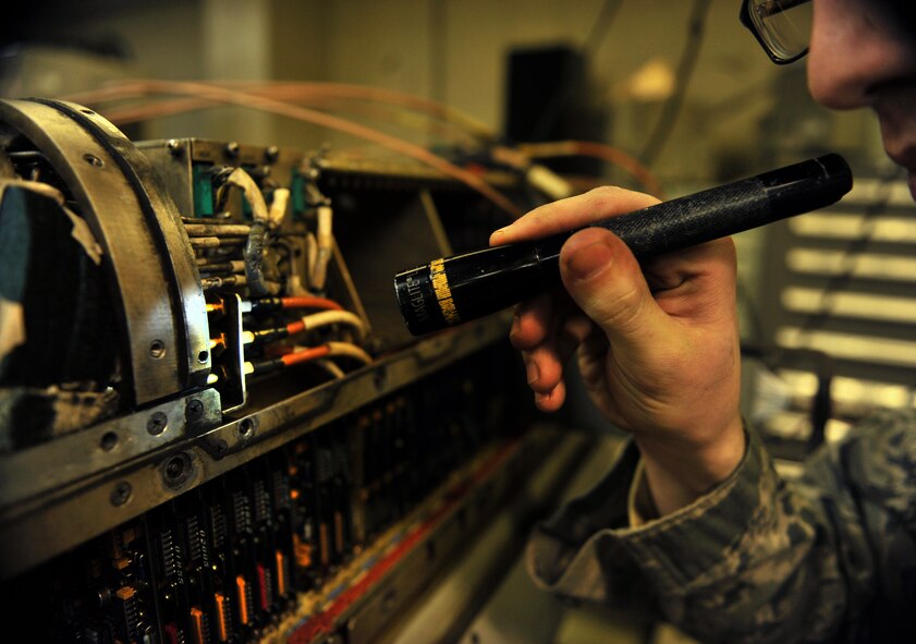Senior Airman Timothy Pack, 51st Maintenance Squadron electronic warfare technician, inspects a component on an AN/ALQ-184 electronic countermeasure pod at Osan Air Base, Republic of Korea, Feb. 28, 2014. Electronic warfare techs guarantee the safety of Osan’s aircraft fleet by providing total structural and electronic maintenance and repairs to the AN/ALQ-184 ECM pod. (U.S. Air Force photo/Senior Airman Siuta B. Ika)