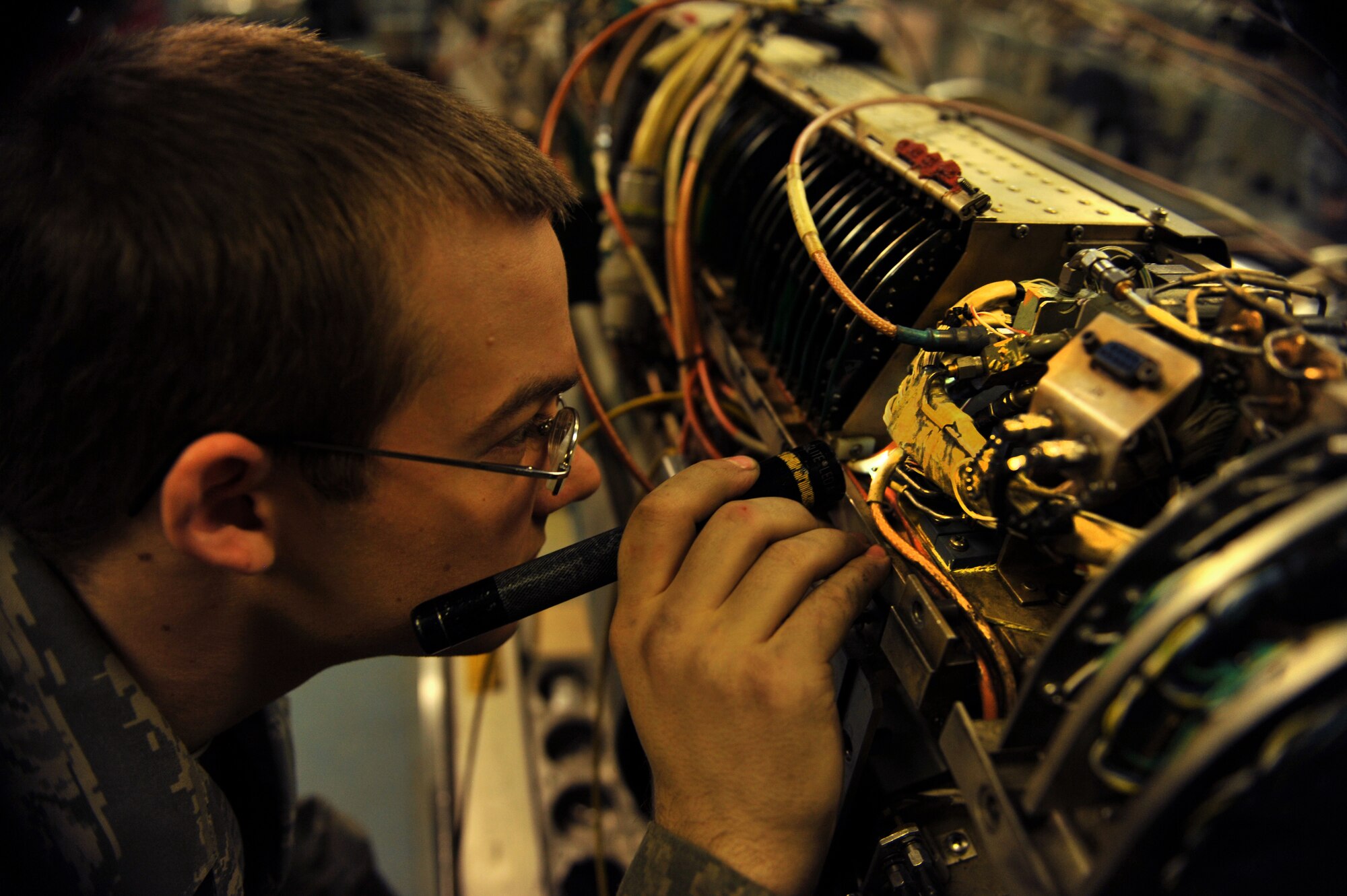 Senior Airman Jonathon Buck, 51st Maintenance Squadron electronic warfare technician, inspects a component on an AN/ALQ-184 electronic countermeasure pod at Osan Air Base, Republic of Korea, Feb. 28, 2014. Electronic warfare techs guarantee the safety of Osan’s aircraft fleet by providing total structural and electronic maintenance and repairs to the AN/ALQ-184 ECM pod. (U.S. Air Force photo/Senior Airman Siuta B. Ika)