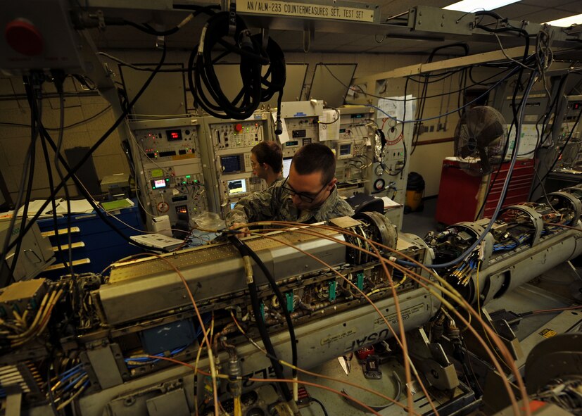 Senior Airman Timothy Pack, 51st Maintenance Squadron electronic warfare technician, troubleshoots a problem with an AN/ALQ-184 electronic countermeasure pod at Osan Air Base, Republic of Korea, Feb. 28, 2014. The AN/ALQ-184 provides instantaneous radio frequency signal processing that is wide open in angle and frequency. (U.S. Air Force photo/Senior Airman Siuta B. Ika)