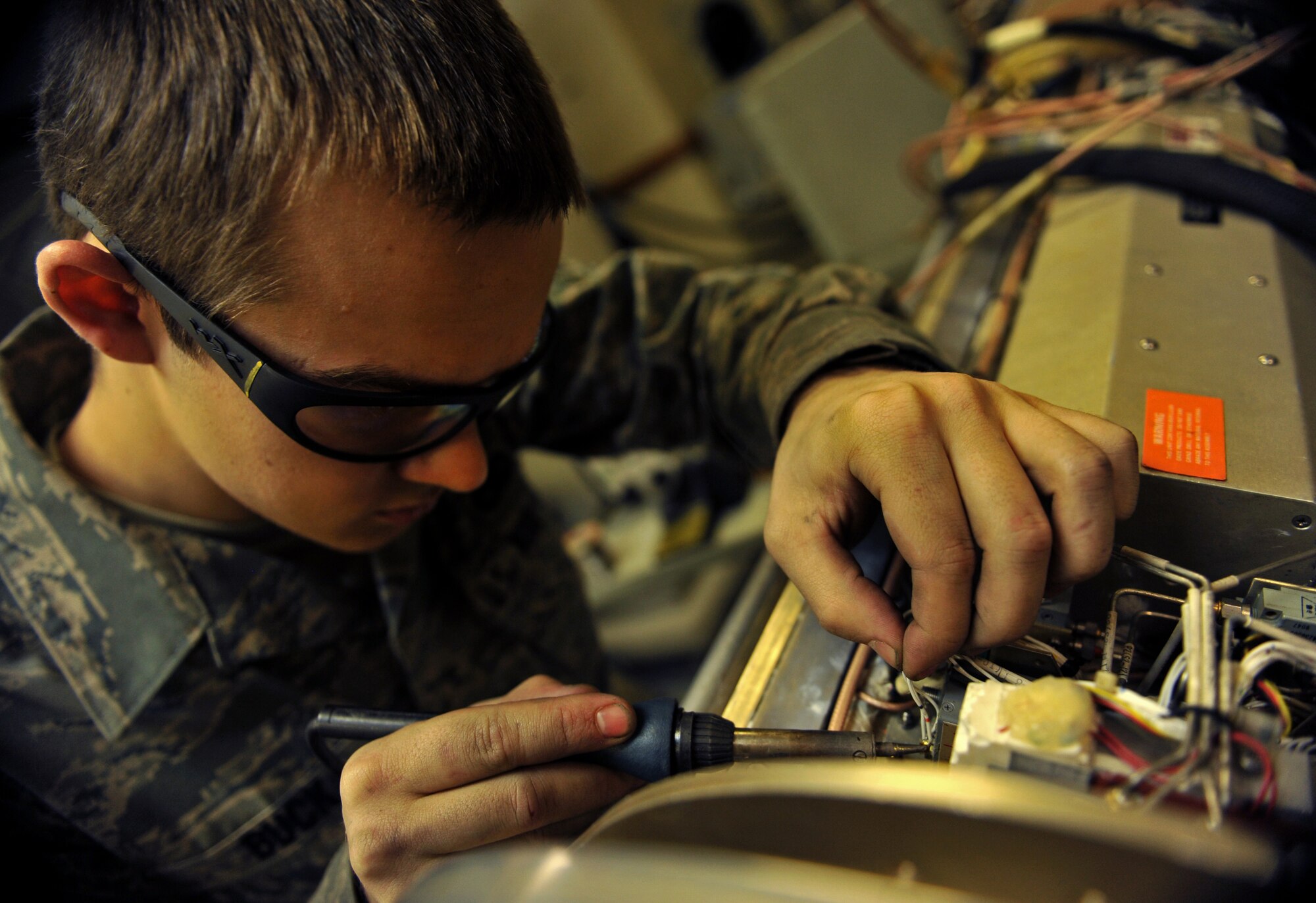 Senior Airman Jonathon Buck, 51st Maintenance Squadron electronic warfare technician, checks the functionality of a component on an AN/ALQ-184 electronic countermeasure pod at Osan Air Base, Republic of Korea, Feb. 28, 2014. Buck and other electronic warfare technicians are charged with ensuring Osan’s entire inventory of ECM pods are in good working order. (U.S. Air Force photo/Senior Airman Siuta B. Ika)