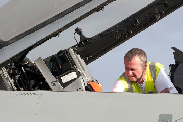 Royal Danish Air Force Lance Cpl. Robert Nielsen, 730th Fighter Squadron crew chief from Skrydsrtup Air Base, Denmark, conducts post flight checks after his squadron’s arrival for Red Flag 14-2 on the Nellis Air Force Base, Nev. flightline, Feb. 26, 2014.  The RDAF is an expeditionary air force with the capability to support both international operations and homeland security.  (U.S. Air Force photo by Senior Airman Matthew Lancaster)