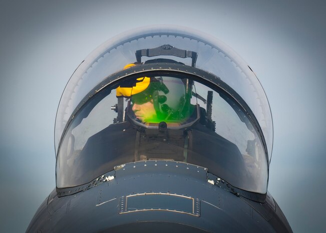 A U.S. Air Force F-15E Strike Eagle pilot from the 336th Fighter Squadron from Seymour Johnson Air Force Base, N.C. goes through post-flight checks during Red Flag 14-2 March 3, 2014, at Nellis AFB, Nev. Red Flag gives aircrews from various airframes, military services and allied countries an opportunity to integrate and practice combat operations. (U.S. Air Force photo by Airman 1st Class Thomas Spangler)