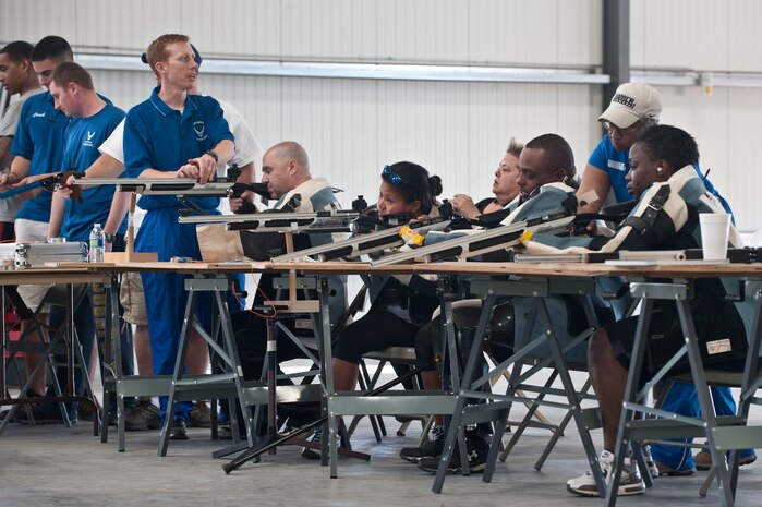 Participants of an Air Force Wounded Warrior Adaptive Sports Camp partake in an airsoft rifle and pistol shooting event Feb. 27, 2014, at Nellis Air Force Base, Nev.  The participants learn how to load rifles and perfect technique with the help of mentors. (U.S. Air Force photo by Senior Airman Matthew Lancaster)