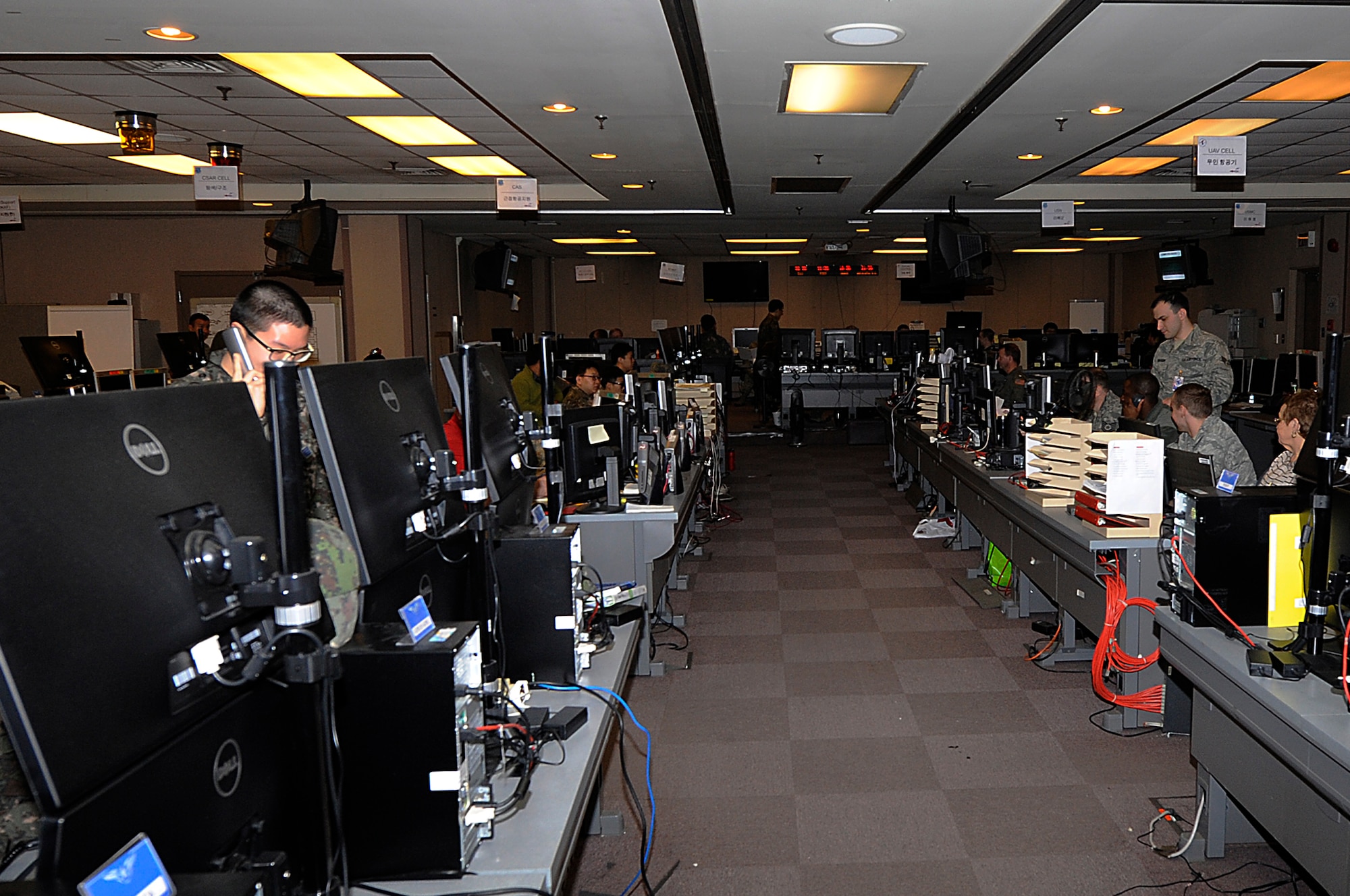 More than 115 U.S. and Republic of Korea Air Force members orchestrate the movements and operations of virtual troops and aircraft  in the Korea Air Simulation Center during Exercise Key Resolve 2014 at Osan Air Base, Republic of Korea, Feb. 28, 2014. The KASC uses modeling and simulation technology to create graphically represented, synthetic environments for training and mission planning that challenge decision makers, while testing strategy, plans and doctrine. (U.S. Air Force photo/ Senior Airman Marcus Morris)