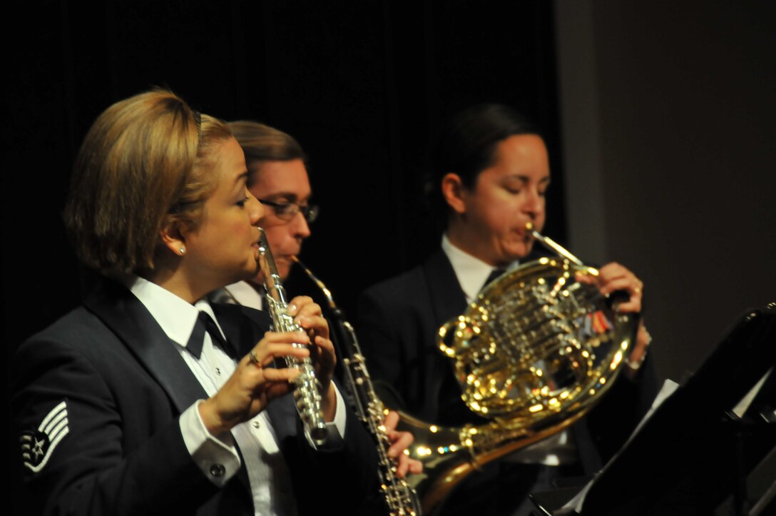 Members of the Band of the Golden West perform as part of a Chamber Recital Series featuring the musicians in various ensembles.  Staff Sgt Melissa Rocha, Staff Sgt Whitney Isbell, and Technical Sgt Charlene Mayes are part of a 7-member group playing a version of Sting's "Seven Days" for an audience at the Vallejo Historical Museum on April 7, 2013  (U.S. Photo by SrA Matthew Garza/released)