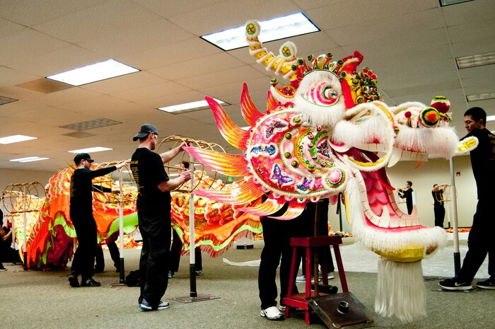 Members of the Bok Kai Dragon Team disassemble the dragon after the Bok Kai Parade March 1, 2014 in Marysville, Calif. The team that performed in the parade consisted with members of Beale Air Force Base and the local community. The dragon name is Hong Wan Lung also known as the God of the River. This is the 134th Bok Kai Parade celebrating the Year of the Horse. The dragon was created in Hong Kong and was first used in the 2009 Bok Kai Parade.(U.S. Air Force photo by Staff Sgt. Jonathan Steffen/Released)