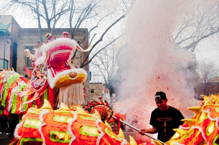 Senior Airman Adam Keydeniers, 9th Aircraft Maintenance Squadron, leads the dragon while fireworks explode at the Bok Kai Parade March 1, 2014 in Marysville, Calif. The team that performed in the parade consisted of members of Beale Air Force Base and the local community. The dragon name is Hong Wan Lung also known as the God of the River. This is the 134th Bok Kai Parade celebrating the Year of the Horse. The dragon was created in Hong Kong and was first used in the 2009 Bok Kai Parade.( (U.S. Air Force photo by Staff Sgt. Jonathan Steffen/Released)