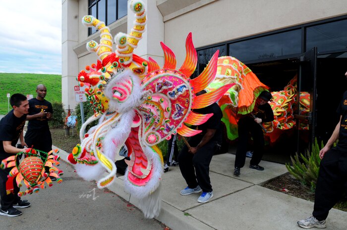 Team Beale and local community members guide the Bok Kai dragon into the facility to be taken apart March 1, 2014 in Marysville, Calif. The dragon was used in the 134th Bok Kai Parade. The dragon was created in Hong Kong and was first used in the 2009 Bok Kai Parade. (U.S. Air Force photo by Airman 1st Class Michael Hunsaker/Released)