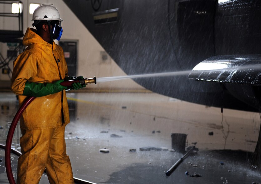 U.S. Air Force Airman 1st Class Robert McMillian, 317th Aircraft Maintenance Squadron aircraft hydraulics apprentice, washes a C-130J Feb. 25, 2014, at Dyess Air Force Base, Texas. The flexible design of the C-130J enables it to be configured for many different missions, allowing for one aircraft to perform the role of many. It takes 12 hours to completely wash the C-130J. (U.S. Air Force photo by Senior Airman Kia Atkins/Released)