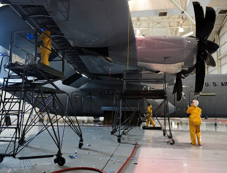 U.S. Air Force Airmen from the 317th Aircraft Maintenance Squadron wash a C-130J Feb. 25, 2014, at Dyess Air Force Base, Texas. The C-130J is the newest generation of the C-130 Hercules which primarily performs the tactical portion of the airlift mission. Each C-130J is washed every 180 days. (U.S. Air Force photo by Senior Airman Kia Atkins/Released)