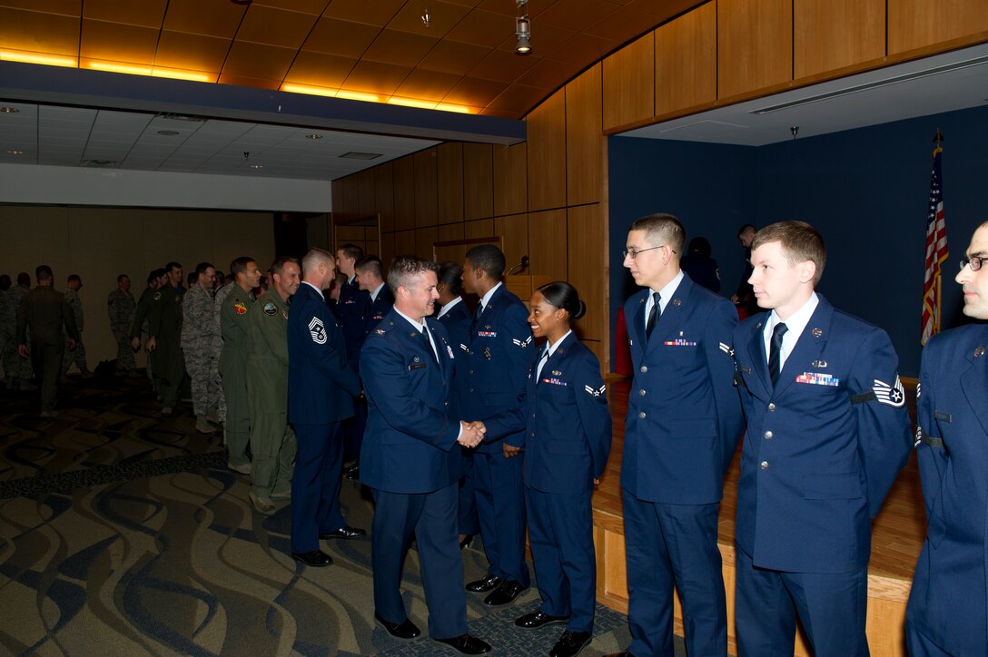 March promotes receive handshakes from base leadership and fellow Team Tyndall Airmen Feb. 28 at the Horizons Community Activity Center. (U.S. Air Force photo by Senior Airman Christopher Reel)
