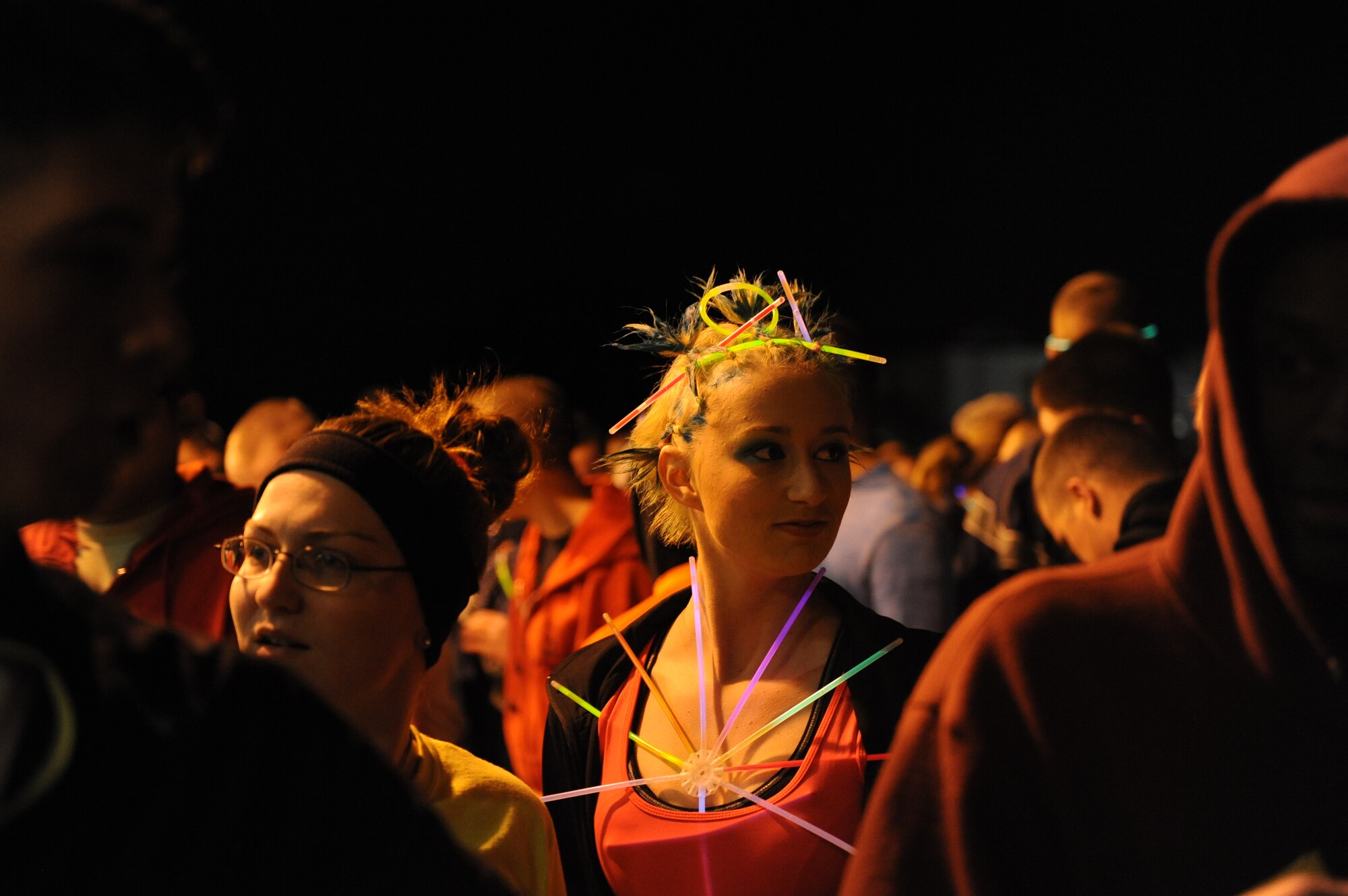 Airman Basic Lacie Hatfield, 336th Training Squadron student, prepares for a 5k glow run hosted by the 81st Training Group teal rope program Feb. 27, 2014, at the Levitow Training Facility, Keesler air Force Base, Miss. The event was held to promote awareness of sexual assault and raise money for a local charity. (U.S. Air Force photo by Airman 1st Class Stephan Coleman)
