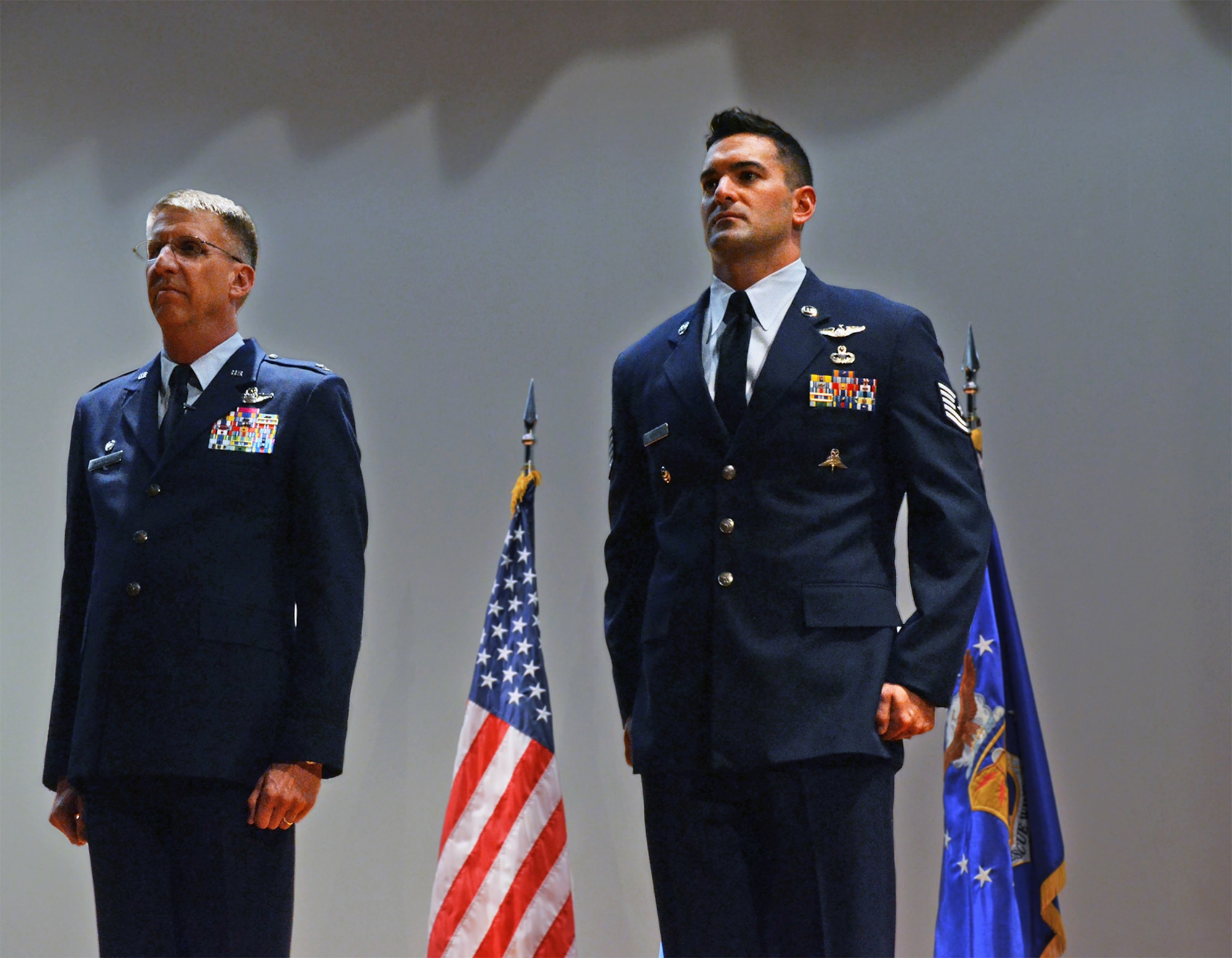 Tech. Sgt. Daniel Warren, a pararescuemen with the 920th  Rescue Wing, Patrick AFB, Fla., received a Bronze Star with Valor for his actions during an insurgent attack on Bastion Airfield, Afghanistan. The attack, which took place during the late hours of Sept. 14, 2012, was the largest enemy assault on an American airfield since the Tet Offensive in Vietnam. Here, Sergeant Warren stands next to 920th Rescue Wing Commander Col. Jeffrey Macrander durning the ceremony for his award, held at the Patrick AFB theater March 2. (U.S. Air Force photo/Master Sgt. Paul Flipse)