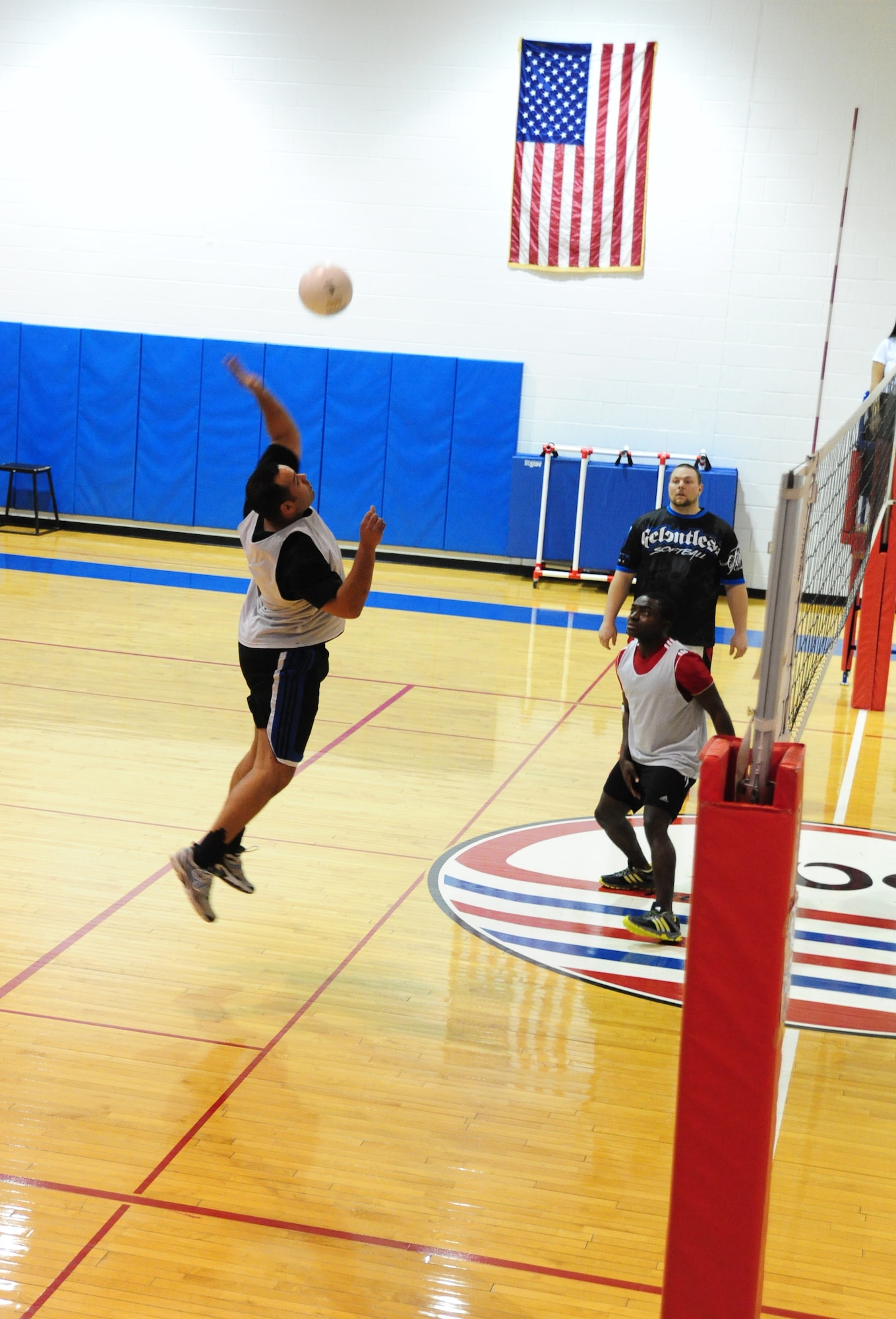 Antone Smith, 509th Force Support Squadron intramural volleyball team, spikes the ball during the second half of a volleyball game against the 709th Munitions Support Squadron. The 509th Force Support Squadron defeated the 709th MUNS after two games one with an overall score of 50-34. (U.S. Air Force photo by Staff Sgt. Nick Wilson/Released)