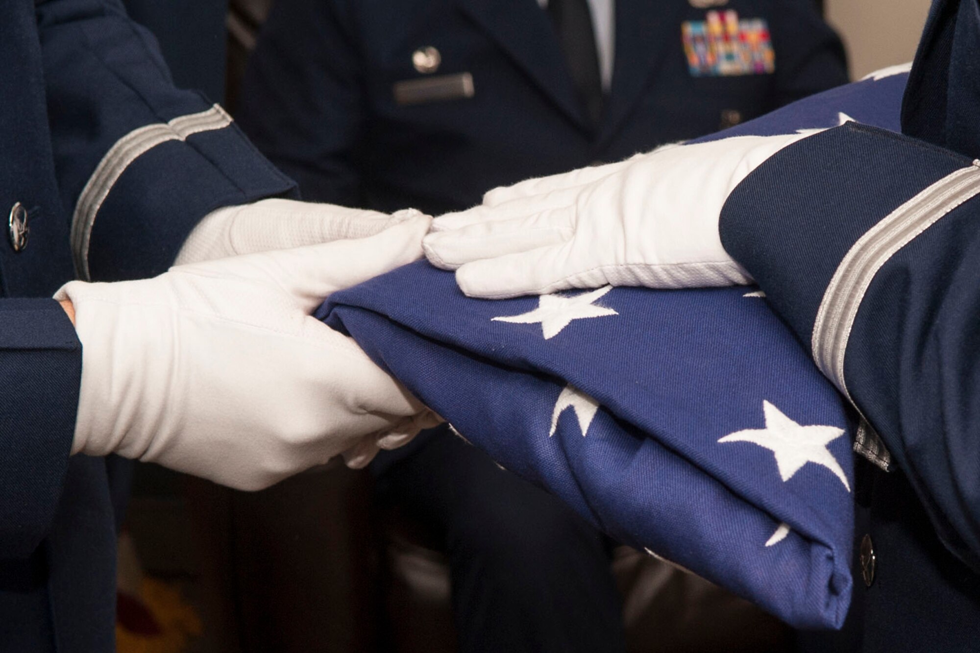 A Flag Folding ceremony is held during the retirement ceremony for U.S. Air Force Tech. Sgt. Richard McCune, Mar. 1, 2014, at Barksdale Air Force Base, La. (U.S. Air Force photo by Master Sgt. Jeff Walston/Released)