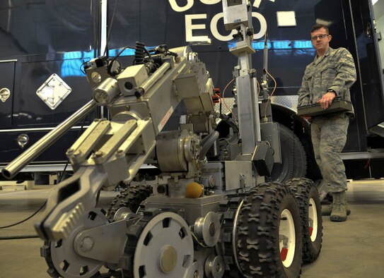 U.S. Air Force Staff Sgt. Donald Ross, 509th Civil Engineer Squadron explosive ordnance disposal team member, operates an F6A robot at Whiteman Air Force Base, Mo., Feb. 11, 2014. This robot is capable of moving certain pieces of ordnance, depending on weight, to safer locations. They place charges on improvised explosive device and detonate them from a distance. (U.S. Air Force photo by Airman 1st Class Keenan Berry/Released)