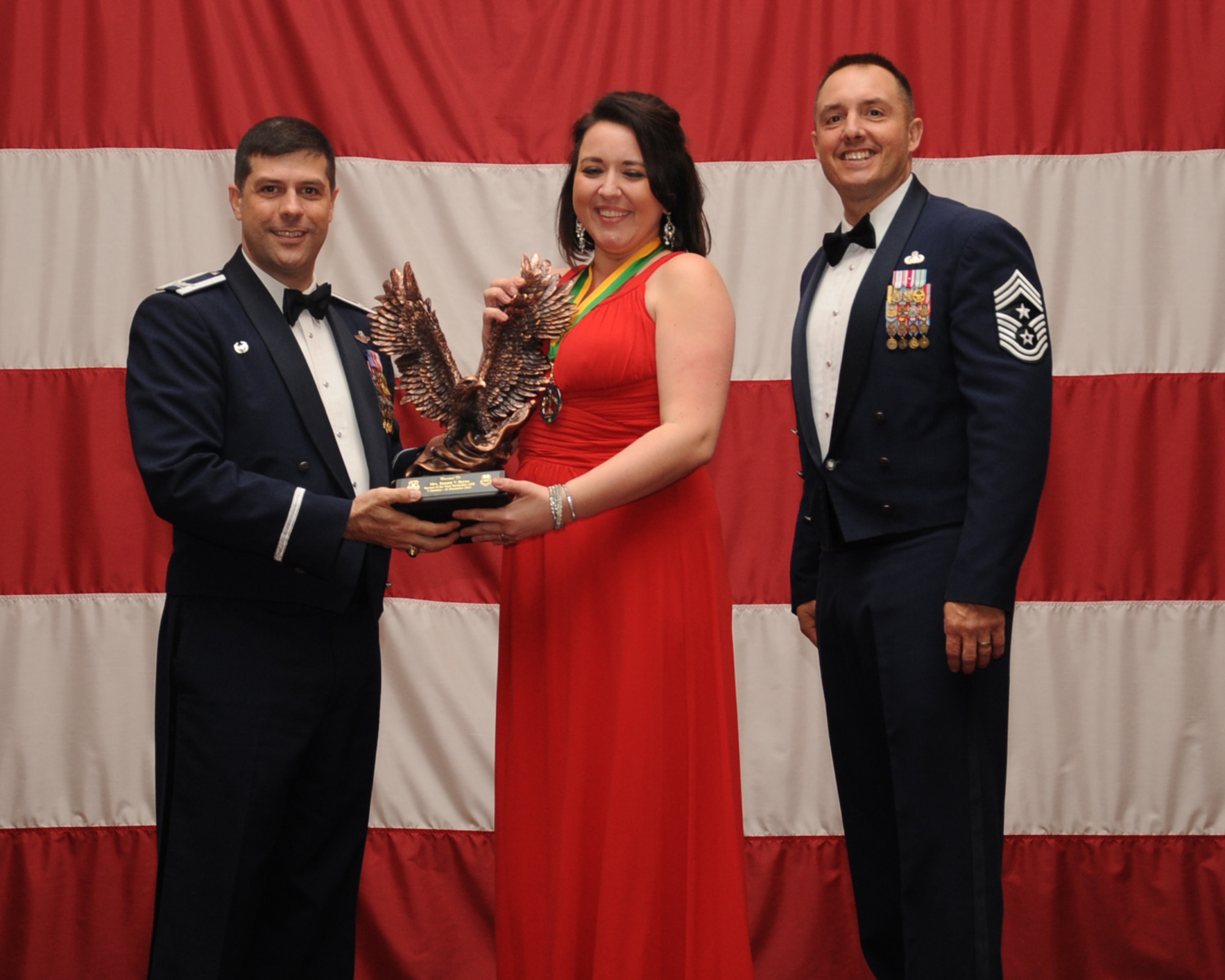 Tammy Reyna is presented the Key Spouse of the Year award during the Annual Awards ceremony at Hoban Hall on Barksdale Air Force Base, La., Feb. 20, 2014. (U.S. Air Force photo/Staff Sgt Sean Martin)
