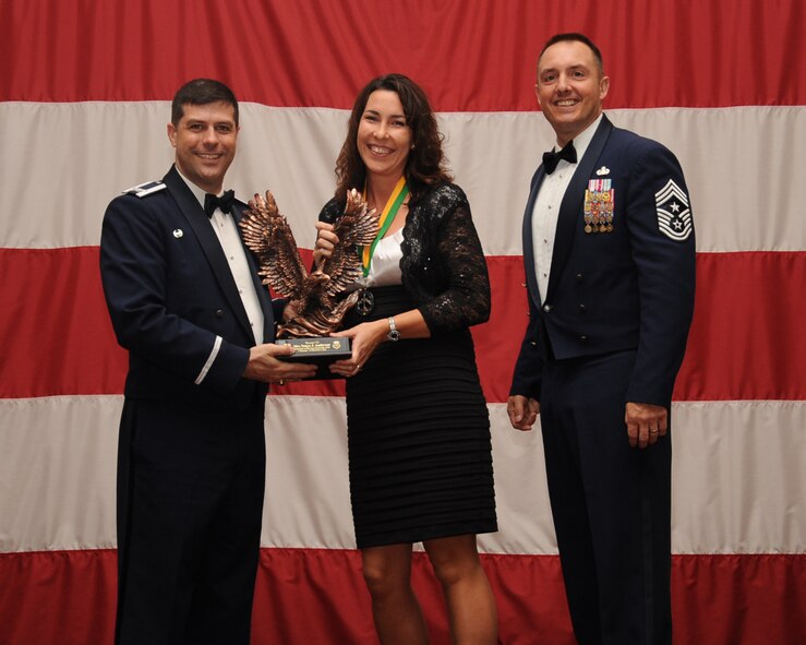 Tanya Anderson, Enlisted Spouses Group, is presented the Volunteer of the Year award during the Annual Awards ceremony at Hoban Hall on Barksdale Air Force Base, La., Feb. 20, 2014. (U.S. Air Force photo/Staff Sgt Sean Martin)

