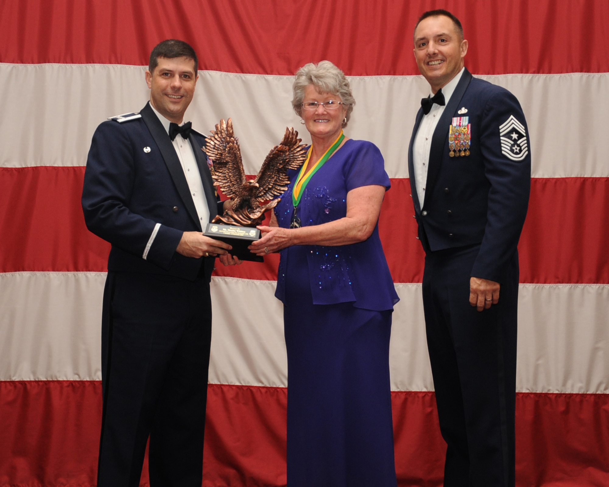 Maxine Whitten, 2nd Medical Group, is presented the Category 2, General Schedule 9 and above Civilian of the Year award during the Annual Awards ceremony at Hoban Hall on Barksdale Air Force Base, La., Feb. 20, 2014. (U.S. Air Force photo/Staff Sgt Sean Martin)
