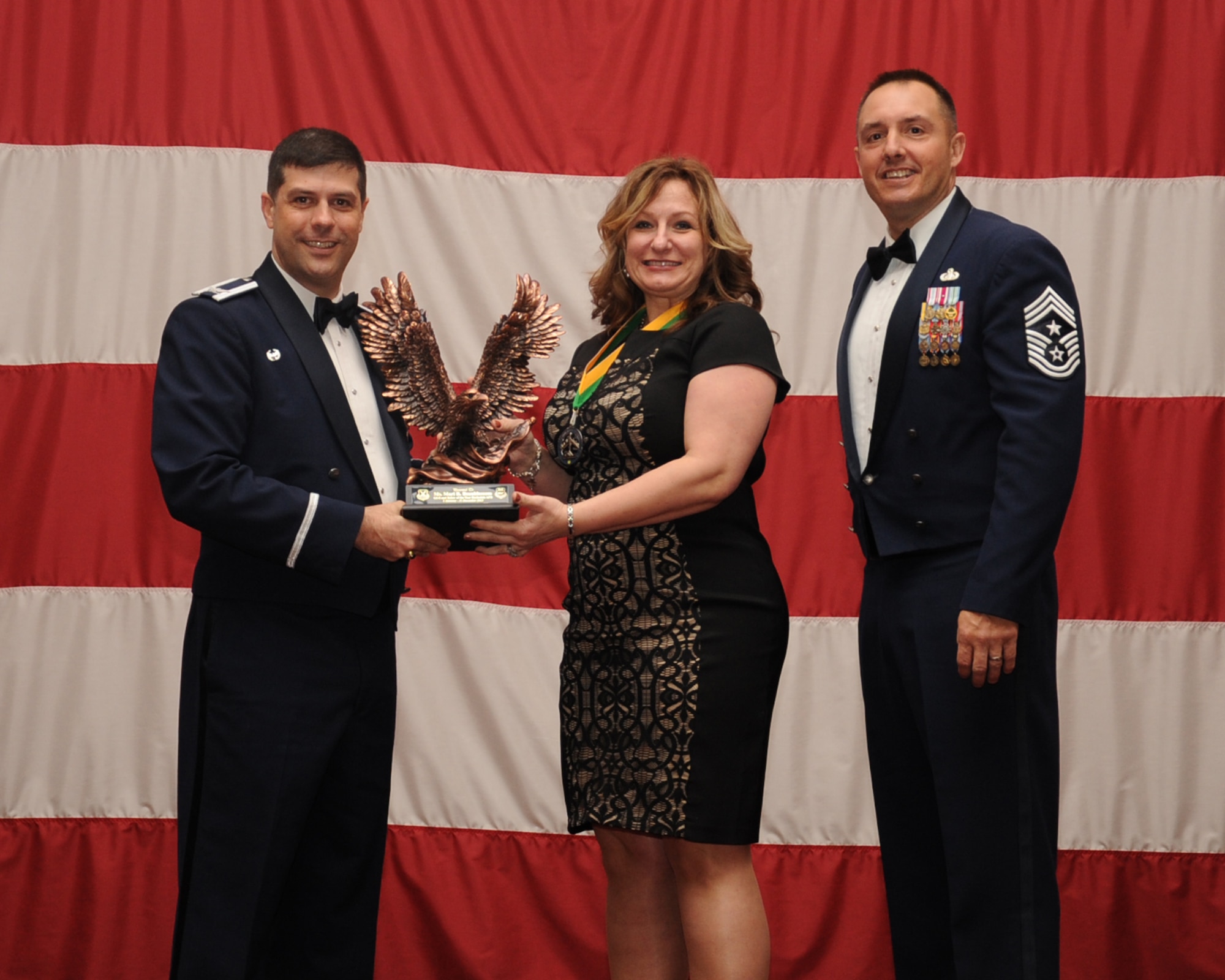Mary Beanblossom, 2nd Bomb Wing, is presented the Category 1, General Schedule 8 Civilian of the Year award during the Annual Awards ceremony at Hoban Hall on Barksdale Air Force Base, La., Feb. 20, 2014. (U.S. Air Force photo/Staff Sgt Sean Martin)

