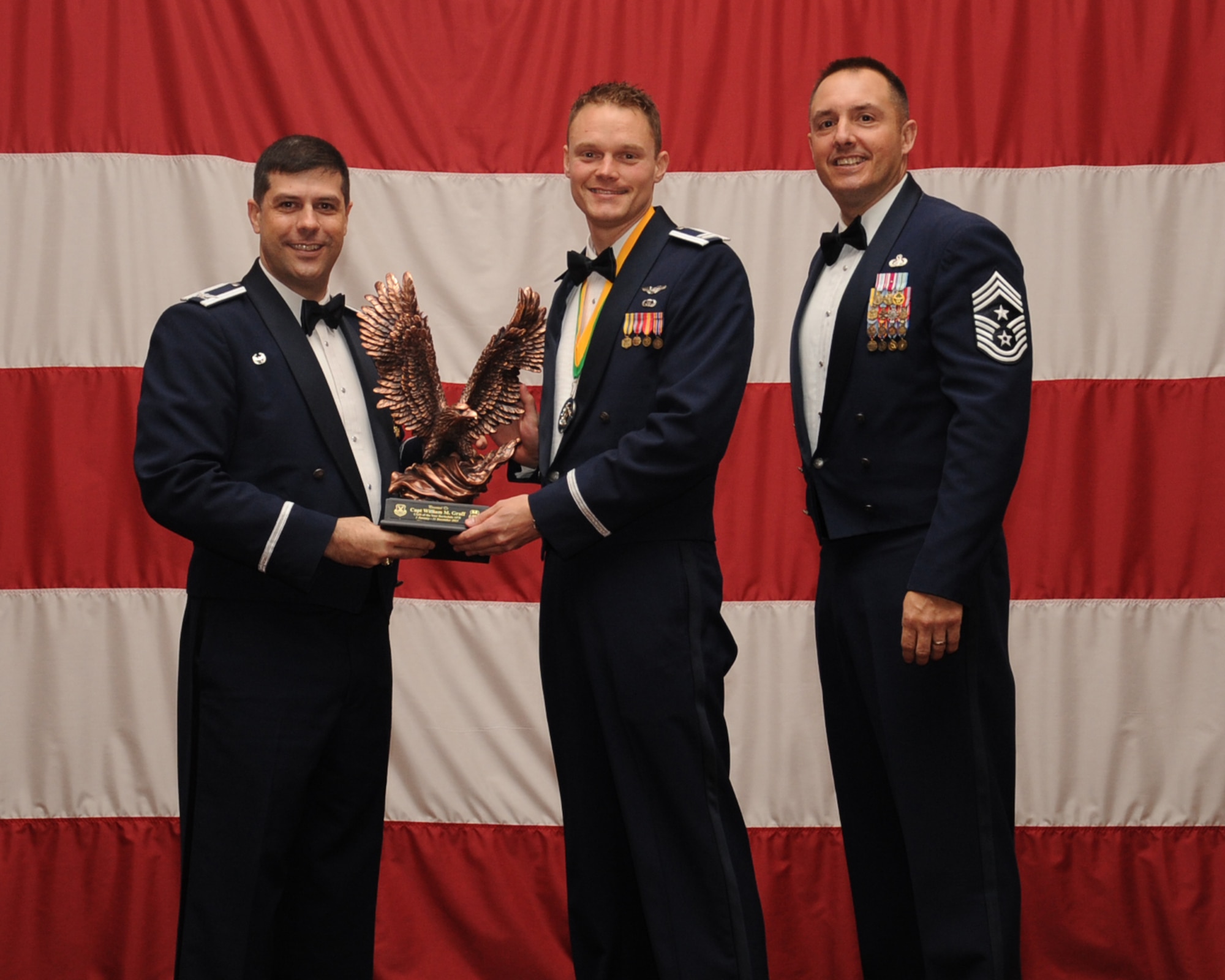 Capt. William Graff , 2nd Bomb Wing, is presented the Company Grade Officer of the Year award during the Annual Awards ceremony at Hoban Hall on Barksdale Air Force Base, La., Feb. 20, 2014. (U.S. Air Force photo/Staff Sgt Sean Martin)
