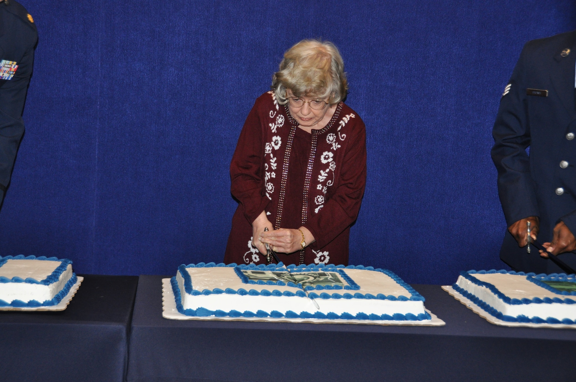 Ms. Linda Bradford, Air Reserve Personnel Center military human resources assistant, cuts the ceremonial cake representing ARPC's location at the former Lowry Air Force Base during a briefing highlighting ARPC’s 60th anniversary Feb. 28, 2014, on Buckley Air Force Base, Colo. More than 150 people attended the event open to all current and former ARPC employees, Buckley AFB leadership and community partners highlighting ARPC’s history and advancement in technology, policies and procedures of six decades and historic memorabilia on display for everyone to see. (U.S. Air Force photo/Tech. Sgt. Rob Hazelett)