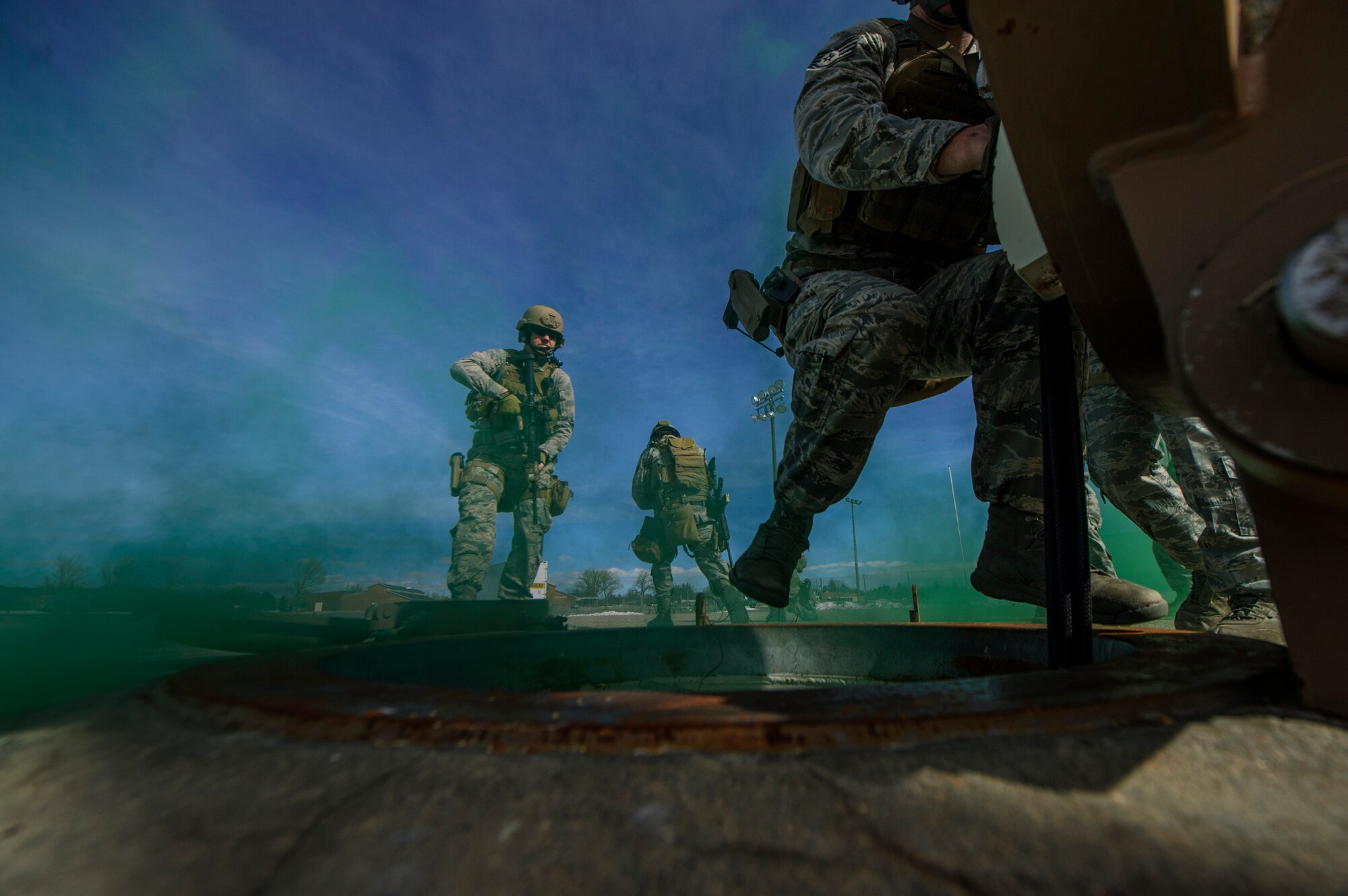 Staff Sgt. Glen Brott, 90th Security Forces Group Tactical Response Force assaulter, rappels down a breached personnel access hatch while Staff Sgt. Scott Shirley, 90th SFG TRF assaulter, provides security during a launch facility re-capture exercise at F.E. Warren Air Force Base, Wyo., Feb. 18, 2014. (U.S. Air Force photo by Staff Sgt. Jonathan Snyder/RELEASED)