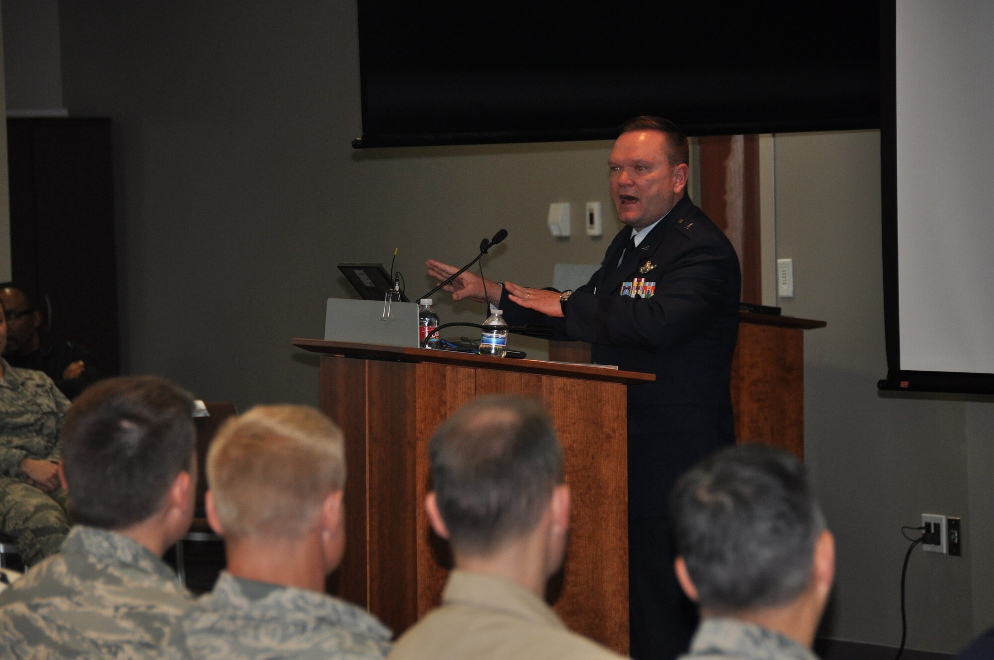 Brig. Gen. Samuel “Bo” Mahaney, Air Reserve Personnel Center commander, addresses more than 150 people during a briefing highlighting ARPC’s history and advancement in technology, policies and procedures of six decades Feb. 28, 2014, on Buckley Air Force Base, Colo. The event was open to all current and former ARPC employees, Buckley AFB leadership and community partners. They were treated to a briefing highlighting ARPC’s history and advancement in technology, policies and procedures of six decades and historic memorabilia on display for everyone to see. (U.S. Air Force photo/Tech. Sgt. Rob Hazelett)