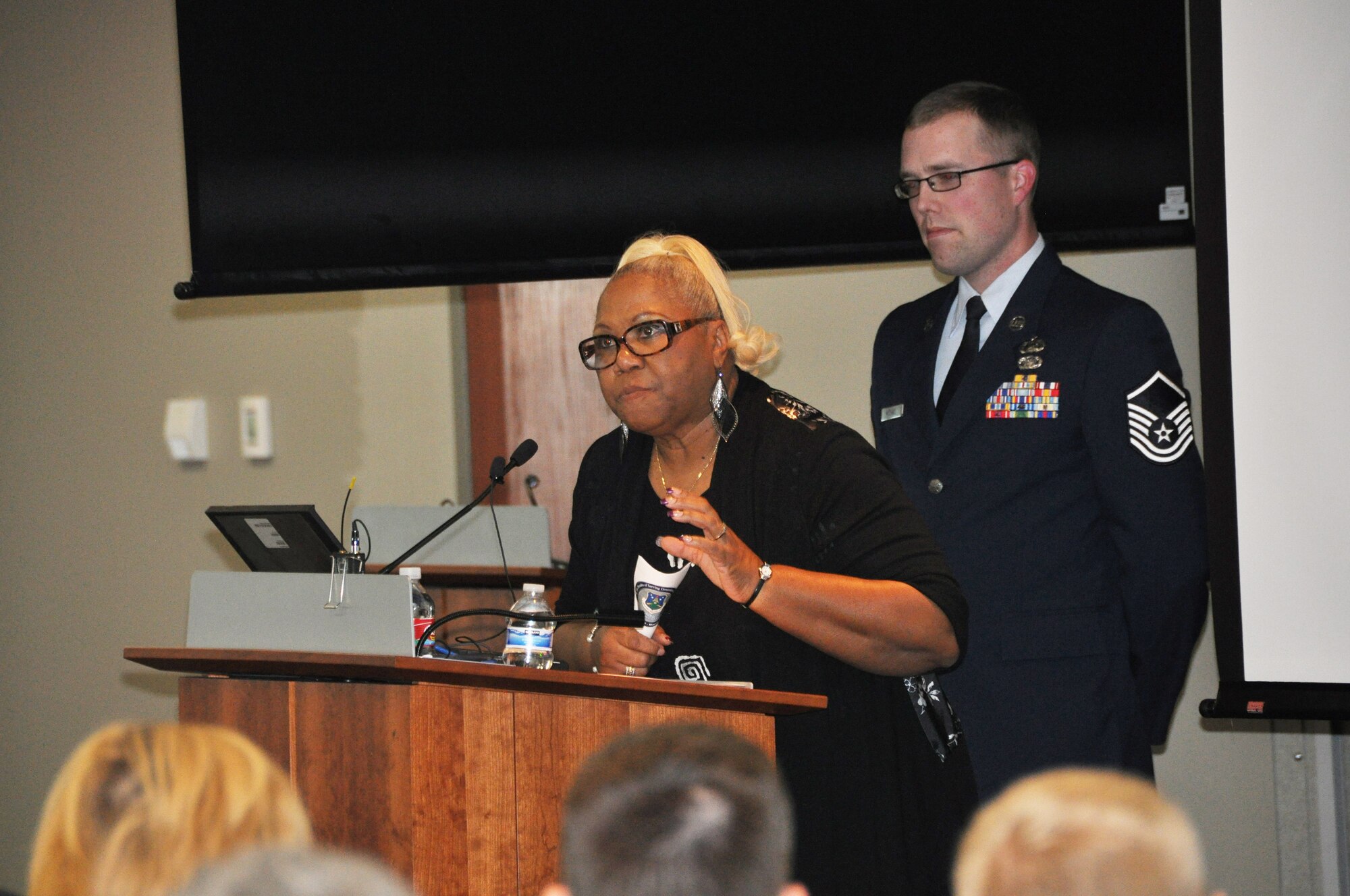 Ms. Gretta Burroughs, Air Reserve Personnel Center accountability officer and contracting officer representative, addresses more than 150 people during a briefing highlighting the ARPC's history and advancement in technology, policies and procedures of six decades Feb. 28, 2014, on Buckley Air Force Base, Colo. The event was open to all current and former ARPC employees, Buckley AFB leadership and community partners. They were treated to a briefing highlighting ARPC’s history and advancement in technology, policies and procedures of six decades and historic memorabilia on display for everyone to see. (U.S. Air Force photo/Tech. Sgt. Rob Hazelett)