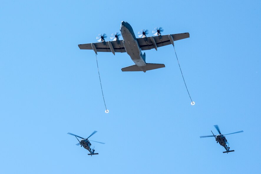 HH-60G Pave Hawks and an HC-130J Combat King II perform aerial refueling at Moody Air Force Base, Ga., Feb. 28, 2014. The refueling was part of a tour of Moody for Secretary of the Air Force Deborah Lee James, who recently took over as the 23rd SecAF, Dec. 20, 2013. (U.S. Air Force photo by Airman 1st Class Ryan Callaghan/Released)