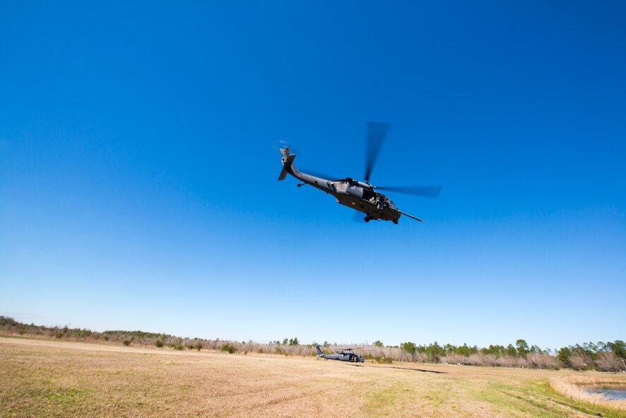 An HH-60G Pave Hawk from the 41st Rescue Squadron takes off with Secretary of the Air Force Deborah Lee James on board at Moody Air Force Base, Ga., Feb. 28, 2014. During the flight, James got an aerial view of Grand Bay Bombing and Gunnery Range. (U.S. Air Force photo by Airman 1st Class Ryan Callaghan/Released)