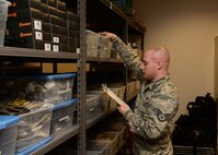 WRIGHT-PATTERSON AIR FORCE BASE, Ohio – Staff Sgt. Justin Landrum, 445th Security Forces Squadron, inventories equipment in the security forces supply room to see if any items need to be replaced or restocked. (U.S. Air Force photo/Staff Sgt. Mikhail Berlin)