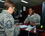 Senior Airman Juanita James, 39 Force Support Squadron personnelist, reviews the in-processing checklist with a customer who recently arrived to the 39th Air Base Wing, March 3, 2014, at Incirlik Air Base, Turkey. The checklist is part of new streamlined process that helps members expeditiously in-process at Incirlik AB. (U.S. Air Force photo by Staff Sgt. Eric Summers Jr./Released) 