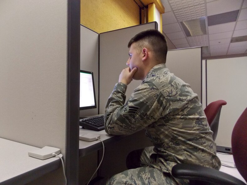 U.S. Air Force Senior Airman Myrick,301st Intelligence Squadron intelligence analyst sit at a desk at Misawa Air Base, Japan Feb. 28, 2014. Myrick conducts in-depth analysis, characterize findings and teams with mission managers to develop viable mission strategies.(Courtesy photo)